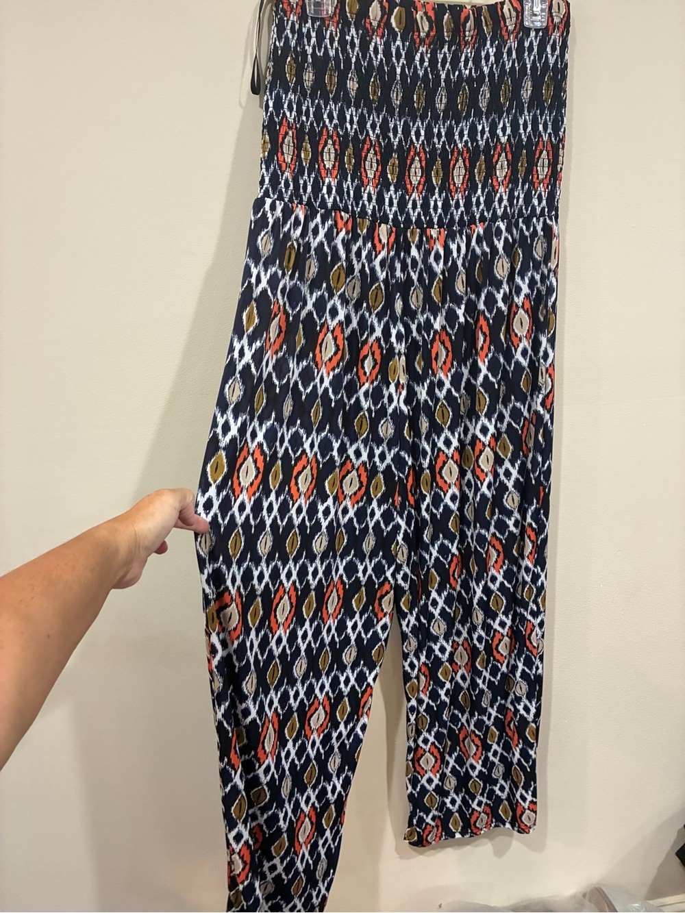 Mlle Gabrielle Navy Smocked Jumpsuit with Coral & Olive Geometric Print